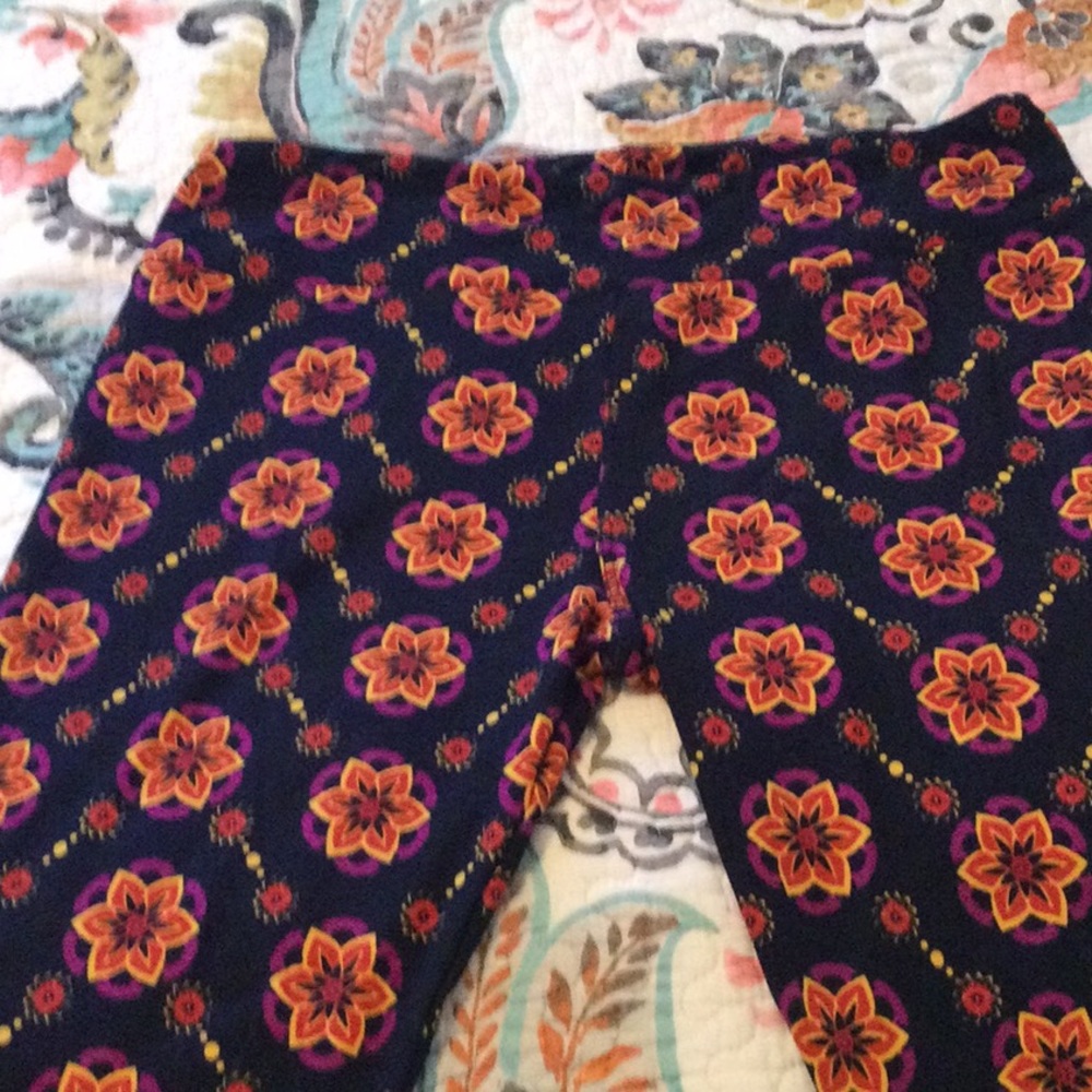 Brand new Lularoe Leggings, Size TC. Black with Floral pattern in purple, gold